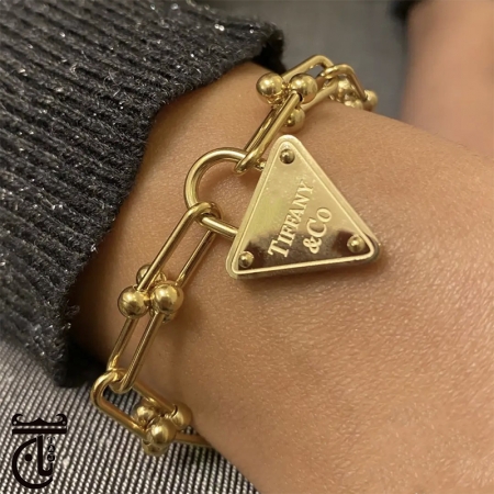  دستبند طرح تیفانی آویز قفل استیل با  آبکاری طلا 